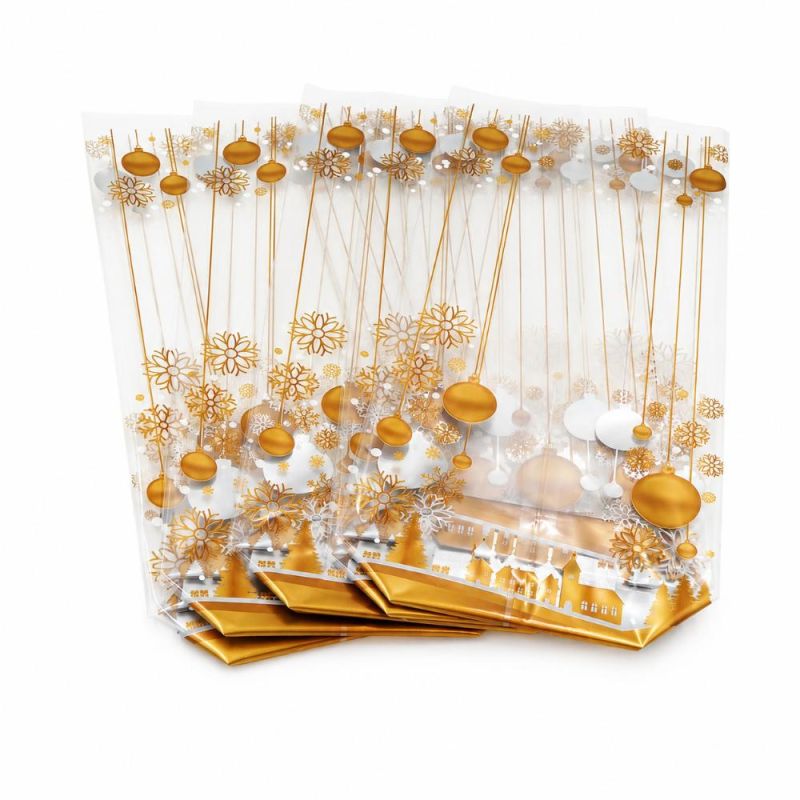 Lot de 5 sachets pour biscuits et confiseries - décor village de Noël doré - 10 × 26 cm Lot de 5 sachets pour biscuits et confiseries - décor village de Noël doré - 10 × 26 cm